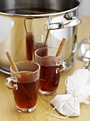 Mulled wine in glasses and pan