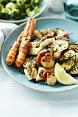 Plate of grilled fish, seafood and vegetables