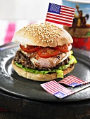 Burger with ham, tomato and lettuce
