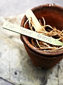 Flowerpots with string and wooden label