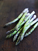 Green asparagus on wooden background