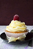 Cupcake with buttercream and raspberry