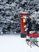 Child posting Christmas cards (UK)