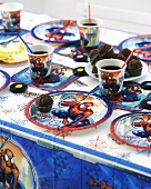 Children's Spiderman party with chocolate muffins, liquorice and drinks