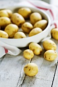New potatoes with dish in background