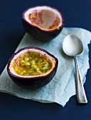 Halved passion fruit with spoon