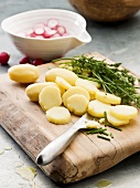 Sliced potatoes, herbs and radishes