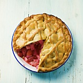 Rhubarb and strawberry pie, a piece removed, from above