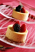 Individual cheesecakes with raspberries and blackberries