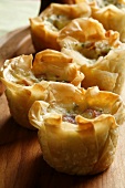 Gruyère and smoked ham in filo pastry shells