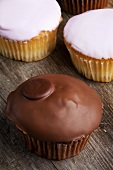 Cupcakes with glace icing and with chocolate icing