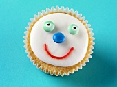 Cupcake mit lustigem Gesicht