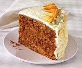 A piece of carrot cake on a plate