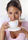 Woman drinking cappuccino