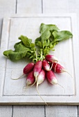 Radishes on a chopping board