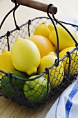 Limes and limes in a wire basket