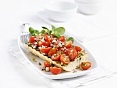 Bruschetta with cherry tomatoes and onions