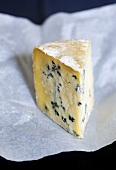 A piece of blue cheese (type: Mrs Temple's Binham Blue, Norfolk, UK)