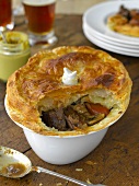 Steak and ale pie with a puff pastry lid (England)
