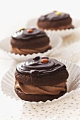 Chocolate whoopie pies with icing and chocolate buttons