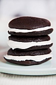 A stack of three chocolate whoopie pies