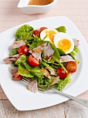 Spinach salad with egg, bacon and cherry tomatoes