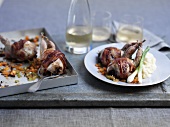Quail's wrapped in pancetta on diced vegetables