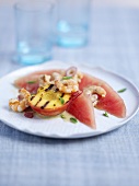 Prawns on watermelon with grilled peach