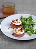 Fried chicken medallions wrapped in Prosciutto
