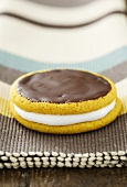 Banana moon pies with a marshmallow filling and chocolate icing