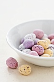 Chocolate eggs with pastel colored sugar glaze