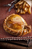 Medium steak pasty (pastry, England) with French fries