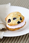 Whoopie Pie with blueberries on a plate with a cloth napkin