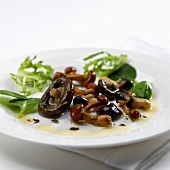 Fried wild mushrooms with a mixed leaf salad