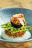 Crab risotto with grilled green asparagus and passion fruit sauce
