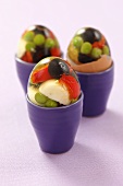 Vegetables in aspic with quail's eggs in egg cups