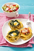 Pasta nests filled with spinach, egg and smoked ham