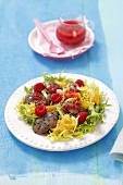 Frisee salad with chicken liver, orange, raspberries and raspberry dressing
