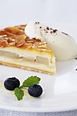 Cream and pear cake with slivered almonds and cream