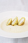Riesling herb soup with pancake and eel rolls
