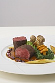Saddle of venison with a pepper crust and rapini