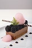 Chocolate slice with blackberries and blackberry foam