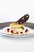A duo of caramel with lingon berries and chocolate, salted crisp bread