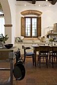 Dining area in an open kitchen of an old mediterranean country home
