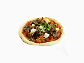 A mini pizza with mushrooms