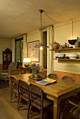 Wooden table with wicker chairs in a country style dining area