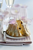 A mini Bundt cake with rose petal icing, sliced