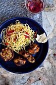 Grilled chicken with spaghetti and lemons