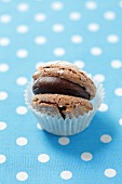 A chocolate-filled macaroon