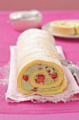 A sponge roll with a strawberry and basil cream filling